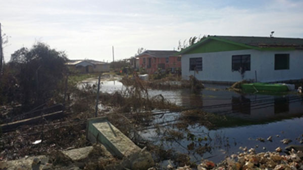 img: Houses in Andros flooded as a result of heavy rains caused by Hurricane Matthew.
