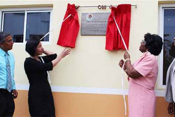 Image: Ambassador Socorra and Dame Pearlette unveil a plaque on one of the buildings.