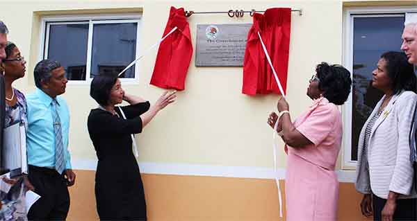 Image: Ambassador Socorra and Dame Pearlette unveil a plaque on one of the buildings.