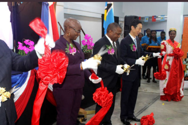 Image: Taiwan’s Ambassador to Saint Lucia, Ray Mou, (fourth from left), Ministers Stephenson King and Fortuna Belrose, and President of the Senate, Andy Daniel, cut the ribbon to declare this year’s trade exhibition open yesterday. [PHOTO: Stan Bishop]