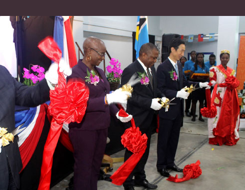 Image: Taiwan’s Ambassador to Saint Lucia, Ray Mou, (fourth from left), Ministers Stephenson King and Fortuna Belrose, and President of the Senate, Andy Daniel, cut the ribbon to declare this year’s trade exhibition open yesterday. [PHOTO: Stan Bishop]