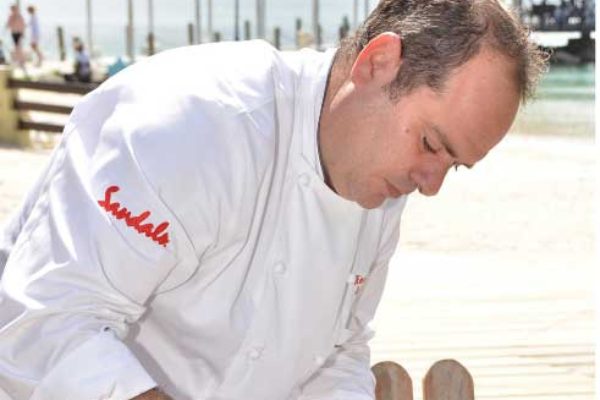 Image: Chef Henrique prepares Lionfish