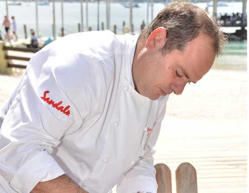 Image: Chef Henrique prepares Lionfish