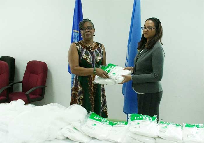 Image: Dr. Belmar George (right) receives the donation.