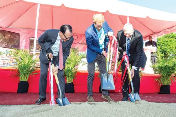 Image: Sod turning: Chairman of DSH Caribbean Star Ltd and China Horse Club, Mr. Teo Ah Khing, Prince Harry and Prime Minister Chastanet break ground for the project.