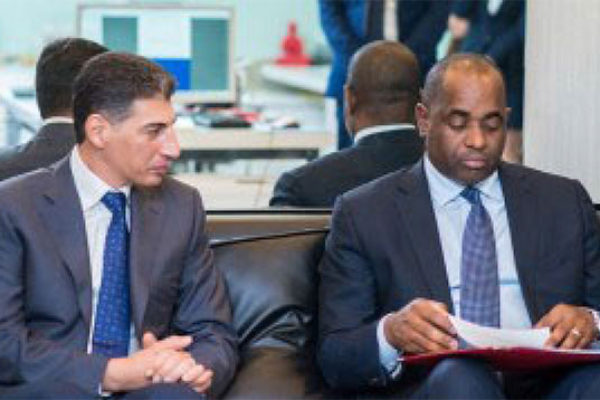 Image: Ali Reza HalatMonfared and Prime Minister Roosevelt Skerrit.