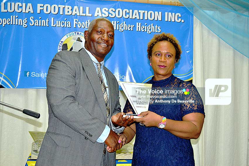 Image: Administrator of the Year Emmanuel Belasse receiving award from Liz Campbell.
