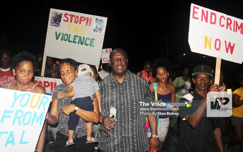 Image: Castries North MP, Stephenson King, leading the candlelight vigil and silent march last Tuesday evening in La Clery. [PHOTO: Stan Bishop]