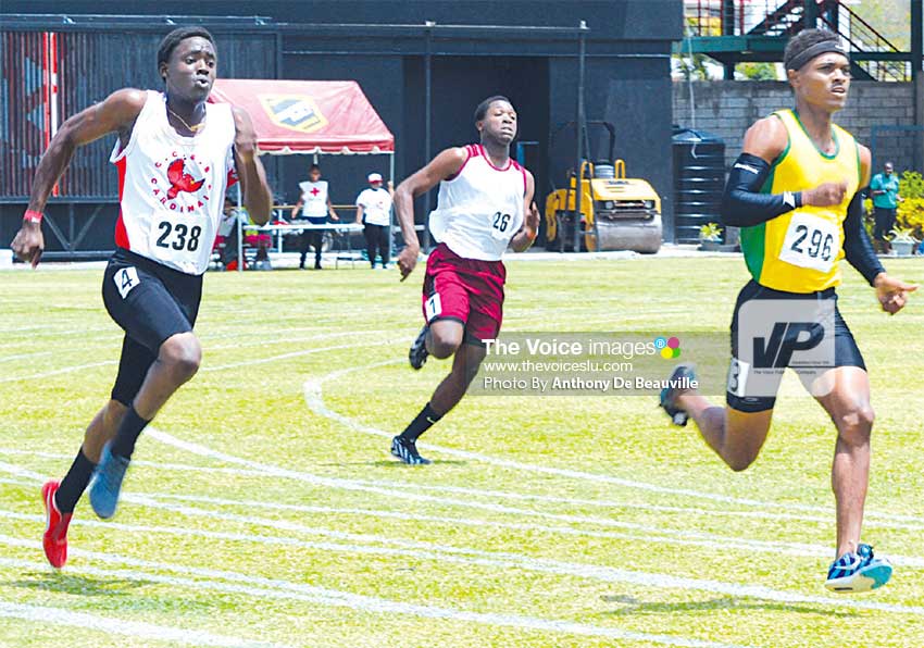 Image: No.238 Jenn-Lux Robert (CCSS) and No.296 Kenneth Verneuil (Choiseul) on the home stretch in the Boys 200 metres Under–18 semi final