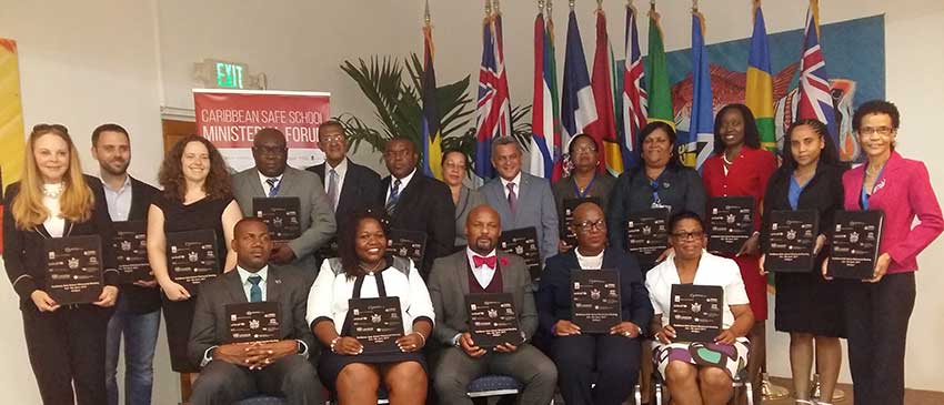 Image: Caribbean Ministers and other high-level officials from the Education sector pose with the signed Antigua and Barbuda Declaration on for School Safety during the Caribbean Safe School Ministerial Forum.