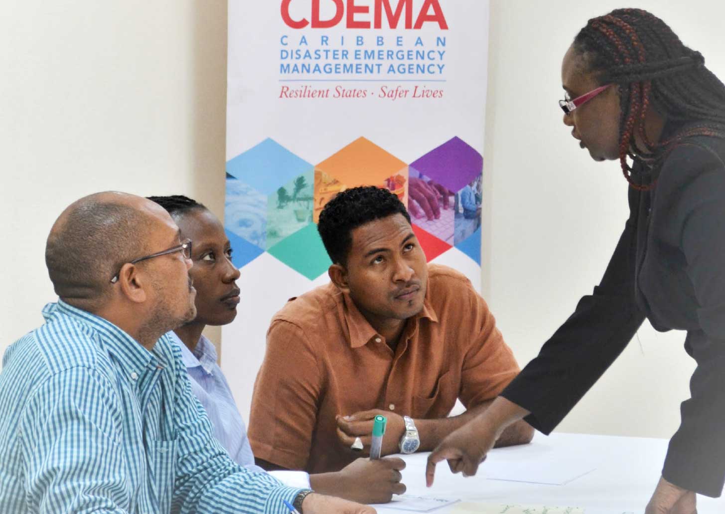Image: Members of the ODM Dominica Staff during an orientation session at the CDEMA Coordinating Unit. L-R: Fitzroy Pascal, National Disaster Coordinator (Ag.), Karen ReviereCuffy, Programme Officer and Donalson Frederick, Programme Officer with Andria Grosvenor, Planning and Business Development Manager, CDEMA.