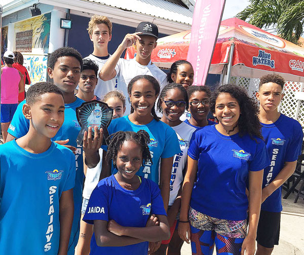 img: Sea Jays – A proud moment for members of Seajays Swim Club as they celebrate their second place finish (Photo: SJ)