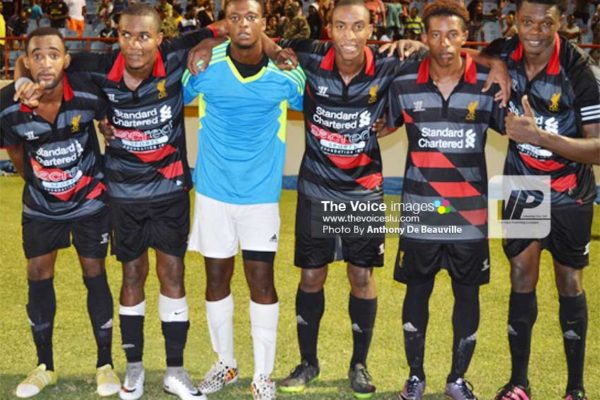 Image: Canaries’ five goal scorers (penalty kicks) and goalkeeper Quami James take a photo moment as they celebrate their stunning victory over Micoud. (Photo: Anthony De Beauville)
