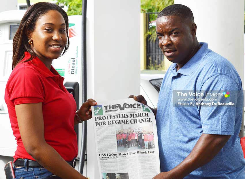 Image: (l-r) RUBIS Marketing Assistant Chriselda Norbal presenting a copy of The VOICE to a customer. (Photo: Anthony De Beauville)