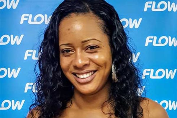 Image: Dwina Charlery of Mon Repos won $300.00 just by topping up her Flow mobile!