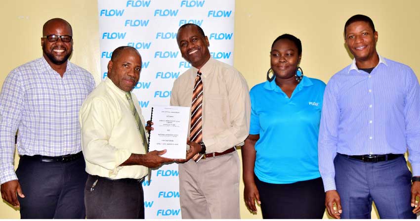 Image: Labour Commissioner Ray Narcisse (second from left) and Flow Country Manager Chris Williams (third from left) present the NWU collective agreement with Flow colleagues.