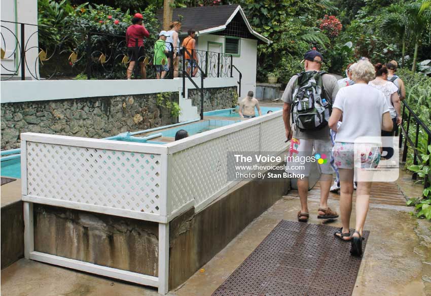 Image of tourists at the mineral baths in Soufriere. [PHOTO: Stan Bishop]