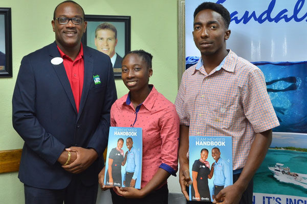 img: (From left to right) Regional Group Manager for Human Resources and Training, Ryan Matthew, with new Sandals interns Kerraul Morgan and Shane David at a recent meeting at Sandals Halcyon Beach Resort.