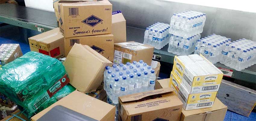 Image - Bottled water, non-perishable food items and other supplies being shipped to Turks and Caicos.