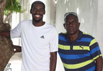 Image: Coach Xavier Samuel (R) with Kyron McMaster who has a world-leading time in the 400-metres hurdles this year.