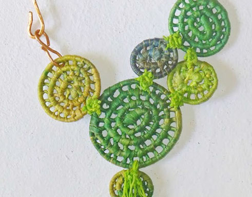 Image of green basket necklace by Finola Jennings-Clark.
