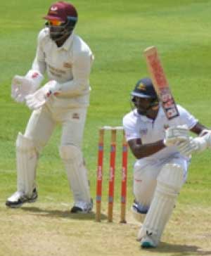 Image of Windies A captain Shamarh Brooks drives through the offside