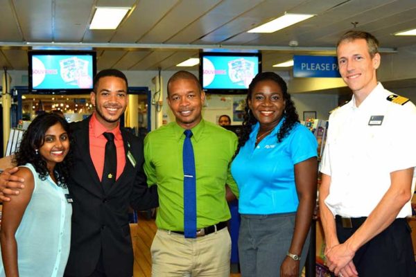 Image: Malerie Pillay and Brandon Kemp of the Logos Hope, Terry Finisterre and Adriana Mitchel-Gideon of Flow Saint Lucia, and Captain Samul Hils.