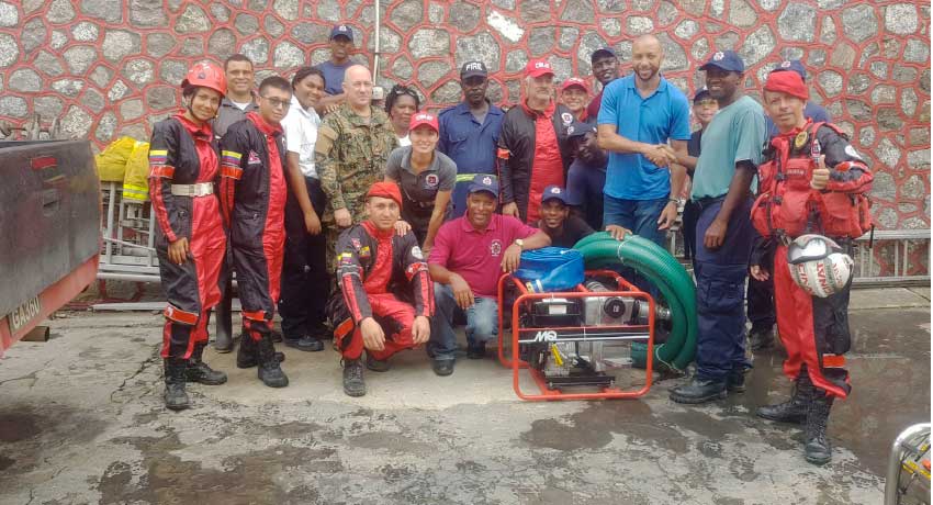 Image: Members of the Dominican fire brigade and personnel from the Colombian and Mexican fire- fighting teams have flown into Dominica to help their colleagues.