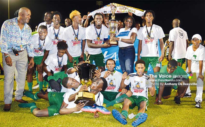 Image: Vieux Fort South celebrate as they receive the championship trophy from FLOW representative. (PHOTO: Anthony De Beauville)