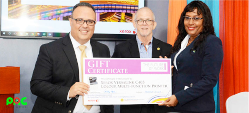 Image: Xerox Future Of Work Event Grand Prize Winner, Gillian Polius – Branch Administrator, Sagicor General Insurance Inc., receives her prize from Joel Mendoza – Country Manager, Xerox Distributor Group, left, and Anthony Bergasse, Managing Director, J. E. Bergasse & Company Ltd. (right).