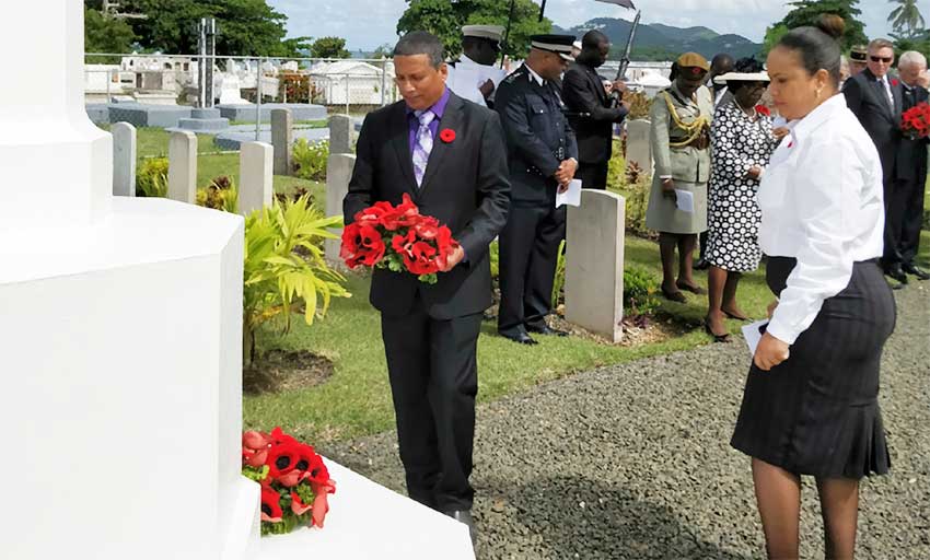 Image: Acting Prime Minister, Guy Joseph, lays a wreath at Choc Cemetery.