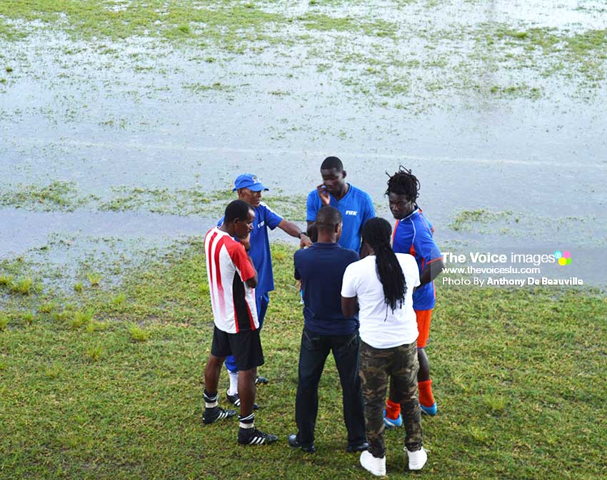 Image: Head of SLFA Referees committee Timothy Joseph (with cap on) and match officials speaking to representatives of Allez and Black Panthers