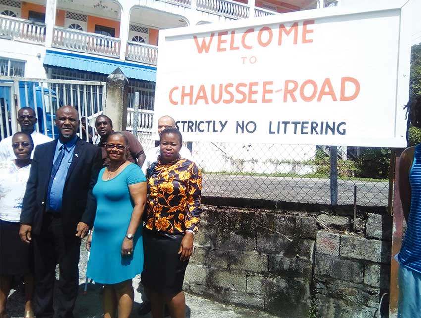 Image of Mayor Francis and members of CROBA in front the billboard placed at a spot where garbage once dominated.