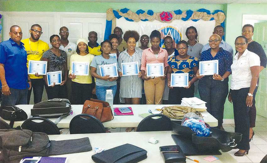 Image of Participants with their certificates at the Belfund workshop.