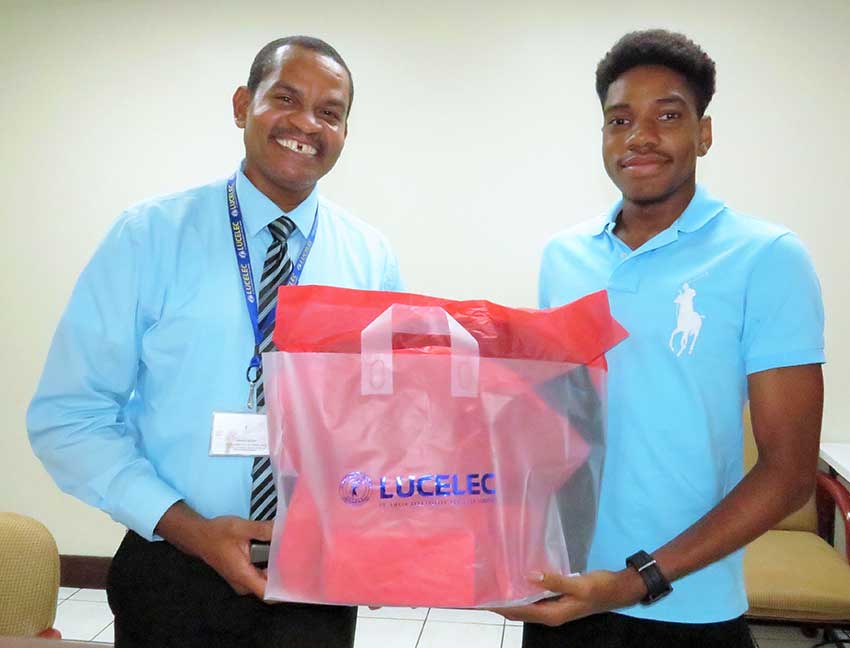 Image:“The LUCELEC sponsored 2017 SPISE student receives a token from LUCELEC Corporate Communications Manager Mr Roger Joseph”