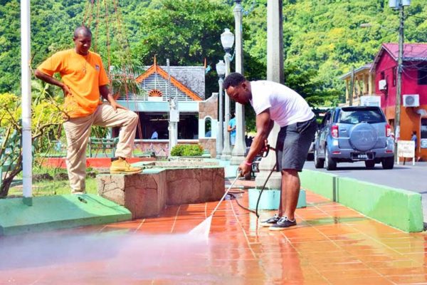 Image: Flow colleagues spent much of the day pressure washing the Soufrière waterfront park.