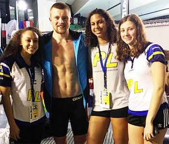 Image of Katie Kyle (third from left) with Great Britian medallist Adam Peatty