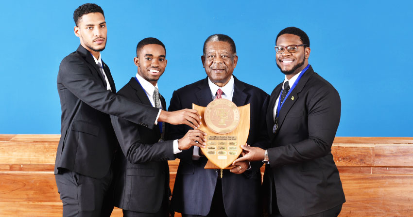 Image: The winning Norman Manley team and the CCJ President.