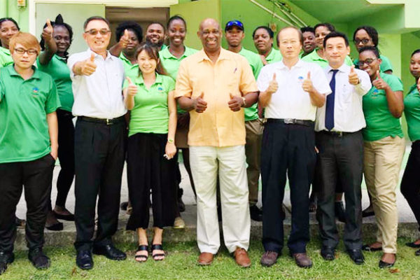 Image: A H.E. Ambassador Douglas Shen (3rd from Left) together with Chairman of the Board / Managing Director Hubert Emmanuel and his entire staff.
