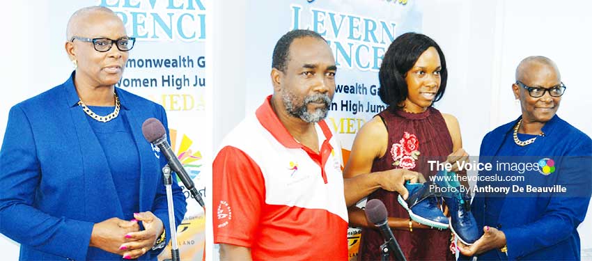 Image: (L-R) SLOC President Fortuna Belrose; SLOC General Secretary and President Alfred Emmanuel and Fortuna Belrose receiving the winning pair of shoes from Levern Spencer. (PHOTO: Anthony De Beauville)