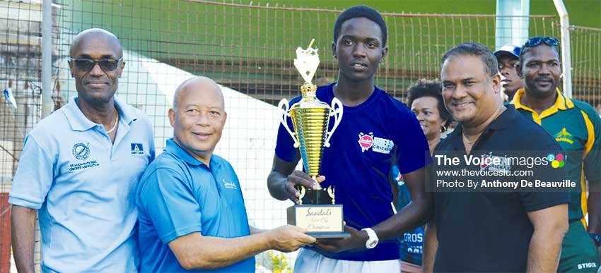 Image: (L-R) SLNCA President, Julian Charles, Sandals Saint Lucia Manager Winston Anderson presenting Gros Islet captain with the championship trophy, while Sandals Regional Public Relations Manager Sunil Ramdeen looks on. (PHOTO: Anthony De Beauville)