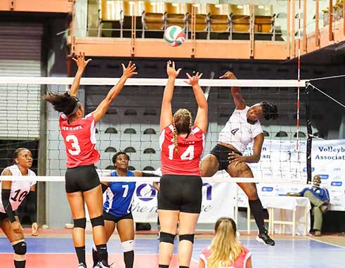 Image of Saint Lucia’s Lisa Casimir (No.4) going airborne as she hit a powerful spike against Bermuda (Photo: ECVA)