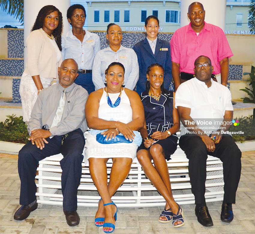 Image: (BACK ROW L-R) – Pamela Nurse and other members of staff, Levern’s Manager, Gregory Dickson - (FRONT ROW L-R) Director For Youth Development and Sports – Patrick Mathurin, Deputy Permanent Secretary - Liota Charlemagne-Mason, Levern Spencer and Minister for Youths Development and Sports Edmund Estaphane. (PHOTO: Anthony De Beauville)