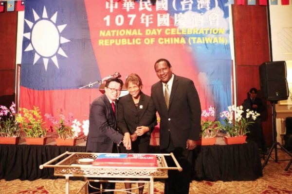 Image: Acting Prime Minister Montoute (right), President of the Senate Giraudy-McIntyre (centre) and Counsellor Huang (left) cut a cake together to celebrate the 107th anniversary of the Republic of China (Taiwan).