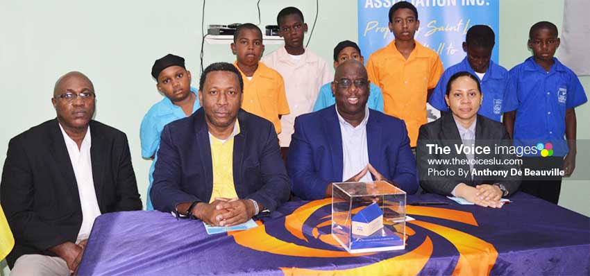 Image: (FRONT ROW L-R) photo moment for SLFA GS – Victor Reid, SLFA President – Lyndon Cooper, CONCACAF Programme Manager - Howard McIntosh, FIFA Development Coordinator – Makaila Church (Back Row) students from the various districts (Photo: Anthony De Beauville). (PHOTO: Anthony De Beauville)