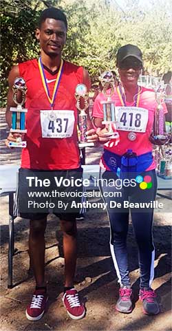 Image: (L-R) Overall male and female winner, Thaddeus George and Terry Hunte. (PHOTO: Anthony De Beauville)