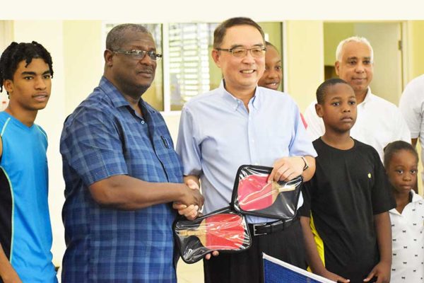 Image: Hon. Stephenson King receiving sporting equipment donation from the Taiwanese Embassy