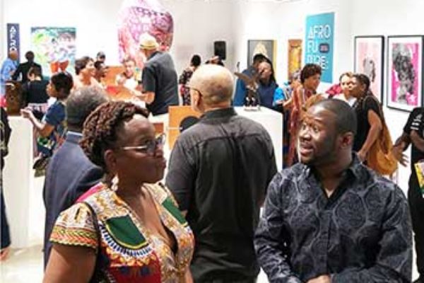 Image: The opening of the AFRO FUTURE art show by CADA & the Miami Design District.
