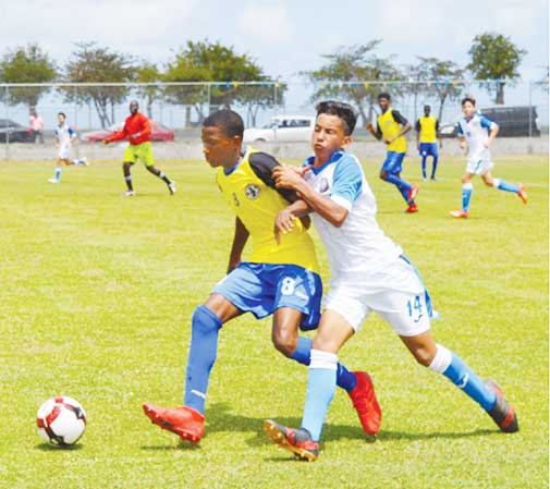 Image: Some of the action on the pitch between Saint Lucia’s No.6 Shaquan Nelson and No. 8 Ajani Hippolyte and Puerto Rico No. 14 Rafael Ramos. (Photo: Anthony De Beauville)