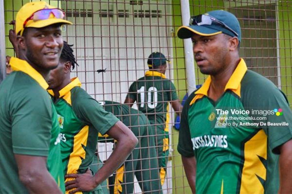 Image: (L-R) Darren Sammy and Johnson Charles planning their strategy during the water break. (PHOTO: Anthony De Beauville)